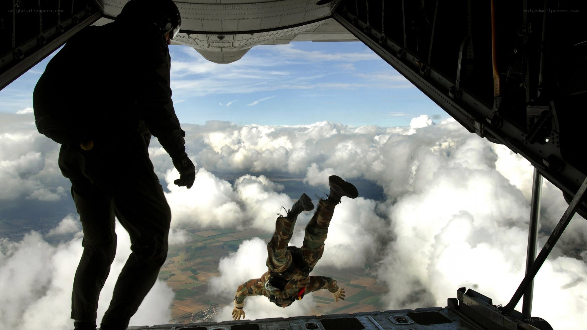 Paratrooper jumping from aircraft