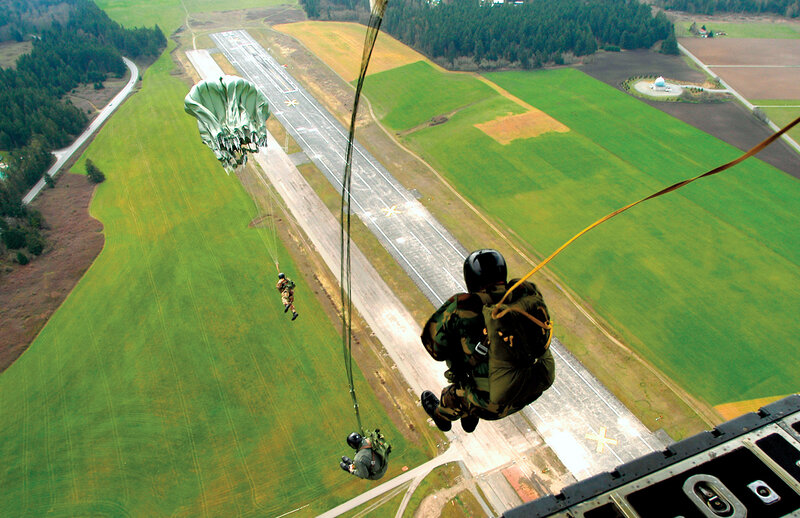 Paratroopers descending on airfield