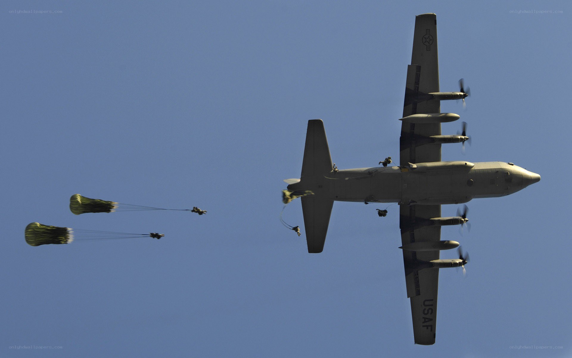 Paratroopers dropping from aircraft