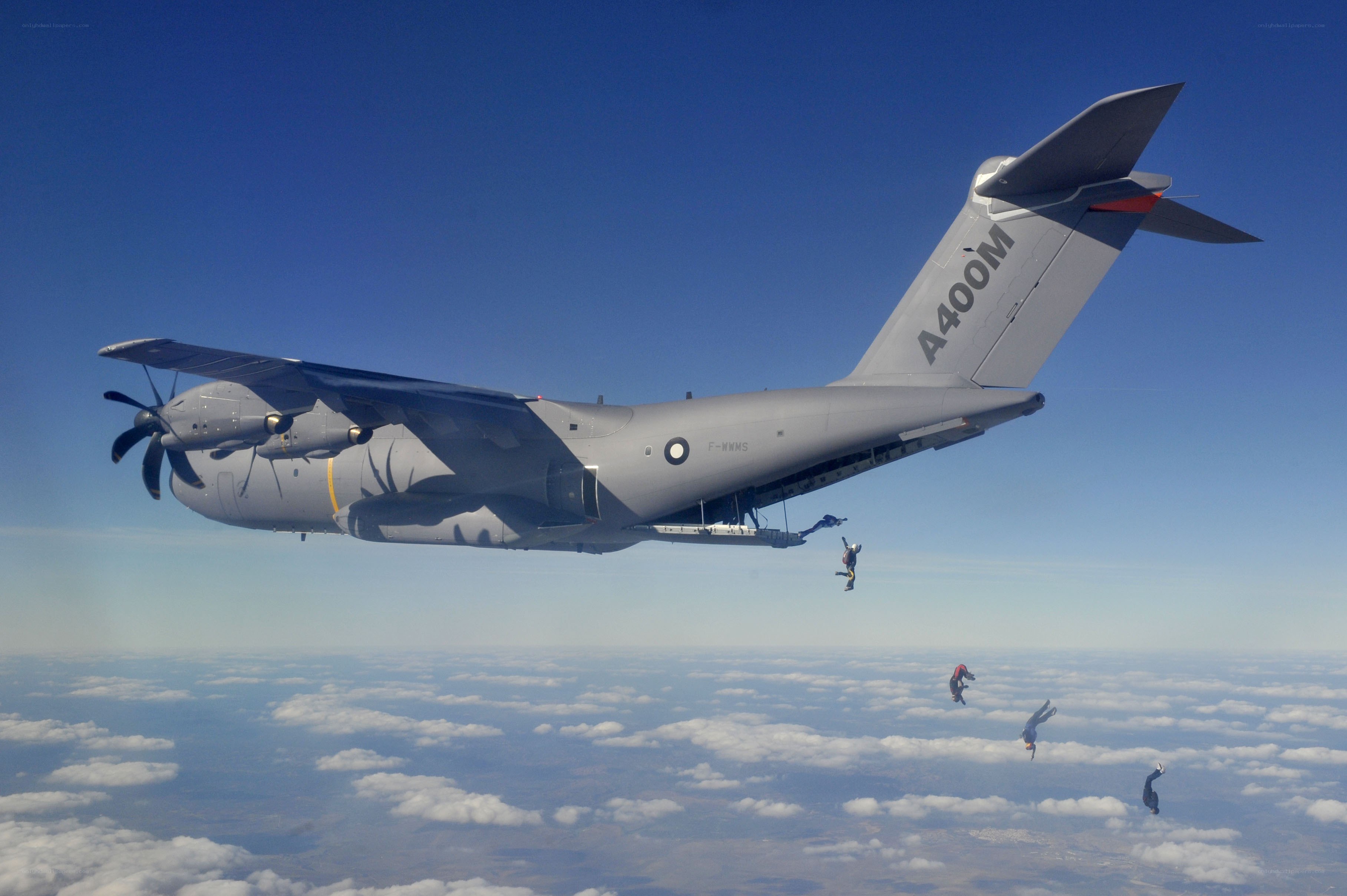 Paratroopers jumping from aircraft