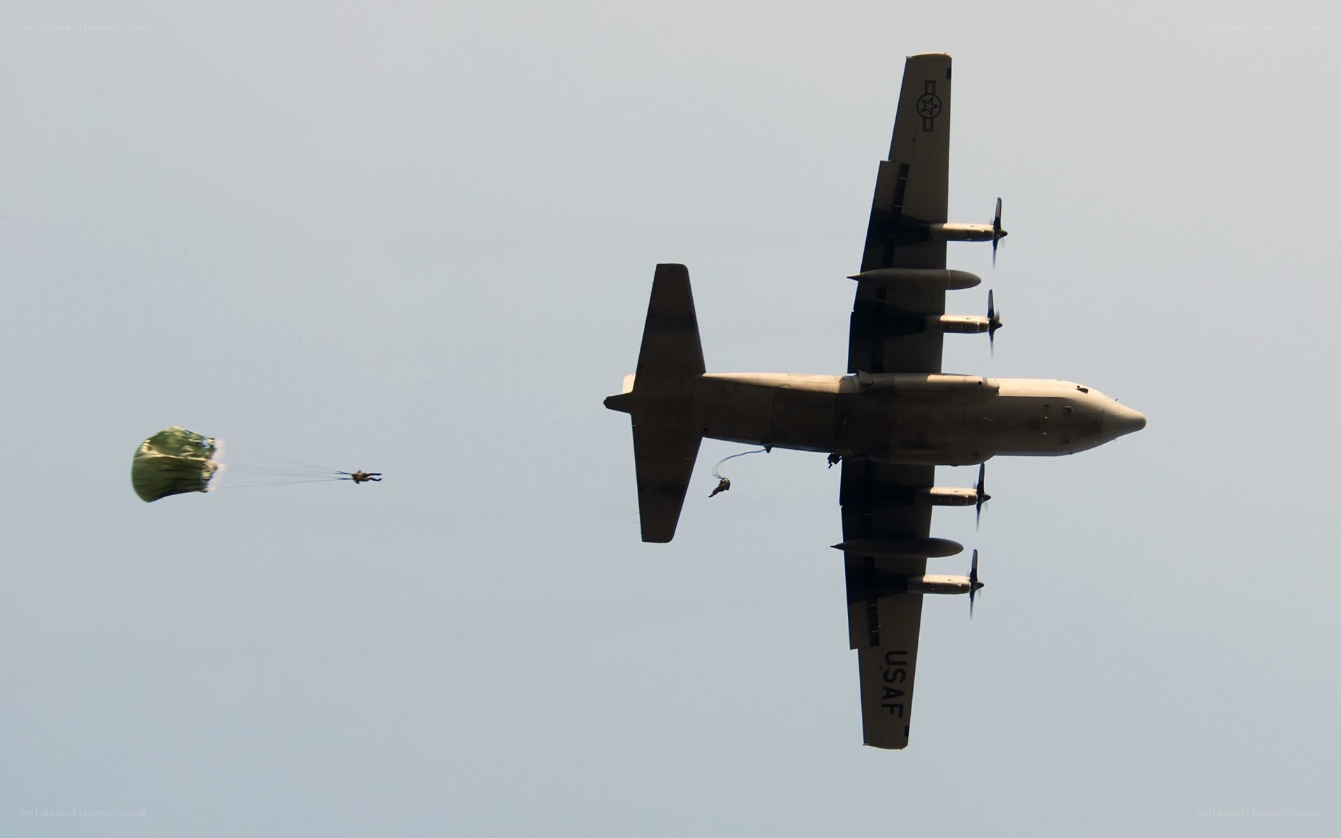 Paratroopers jumping from aircraft