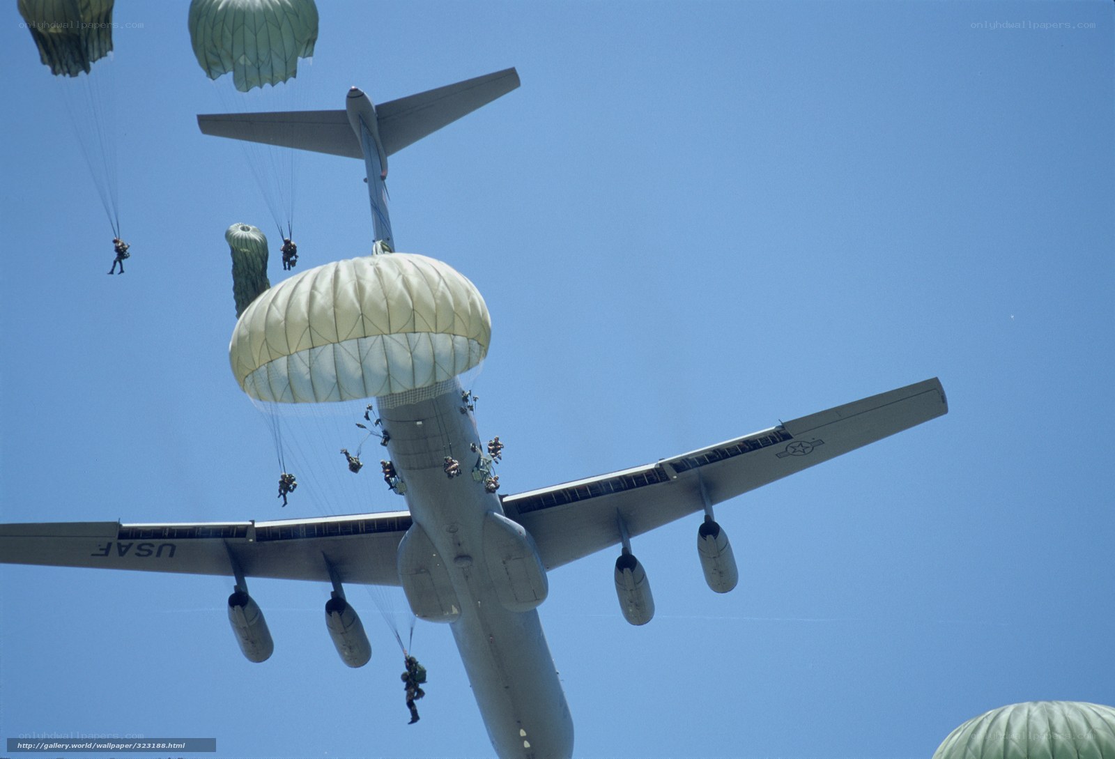Paratroopers jumping from aircraft