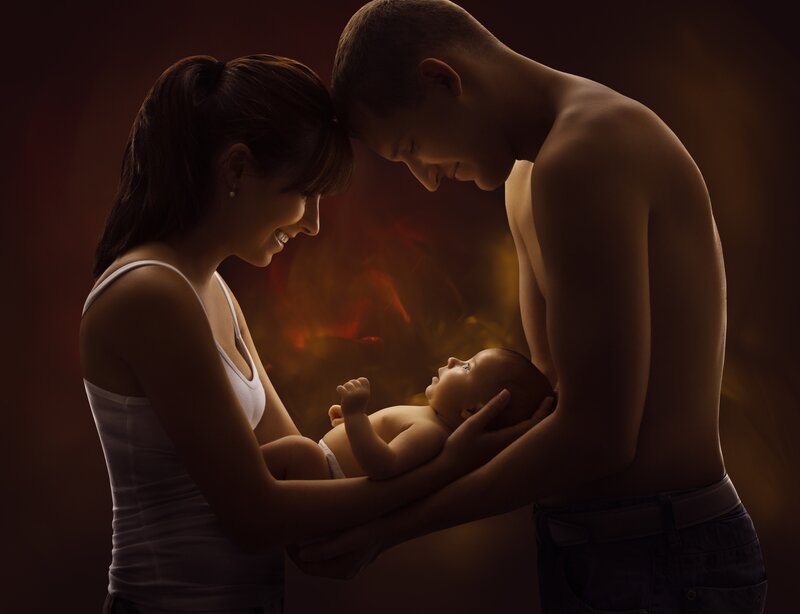 Parents Holding Baby