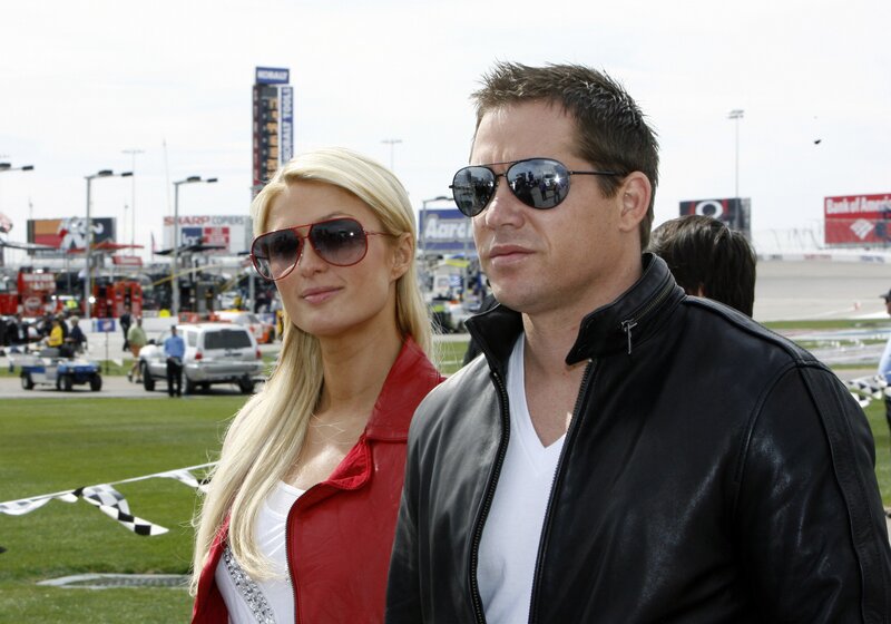 Paris Hilton and a man at a racetrack