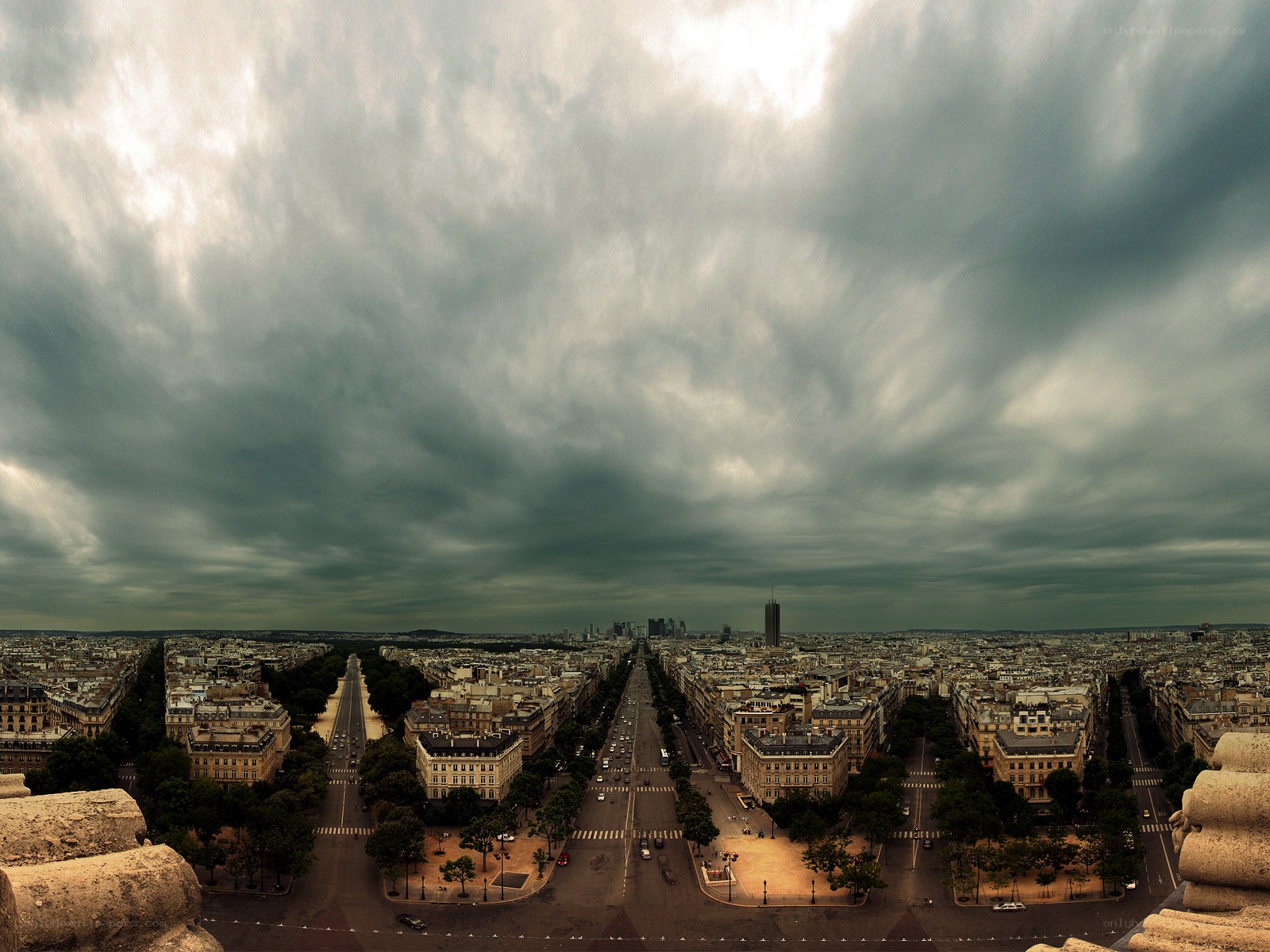 Paris skyline under stormy sky