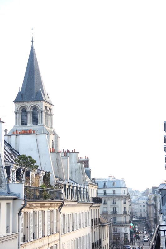 Parisian rooftops and church spire