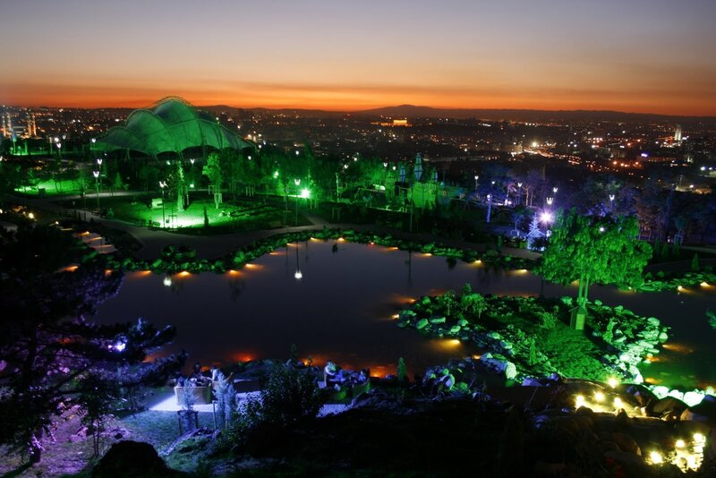 Park at dusk with city view