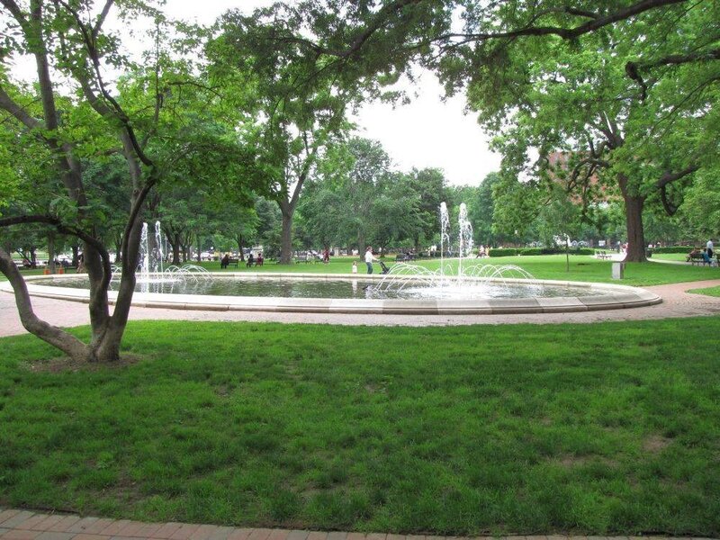 Park fountain with green trees