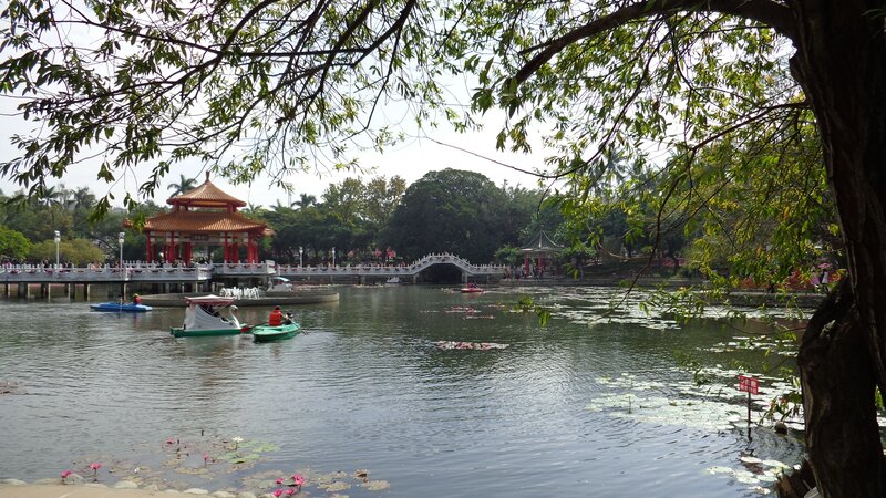Park lake with boats and pavilion
