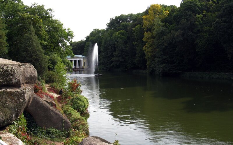 Park lake with fountain and pavilion