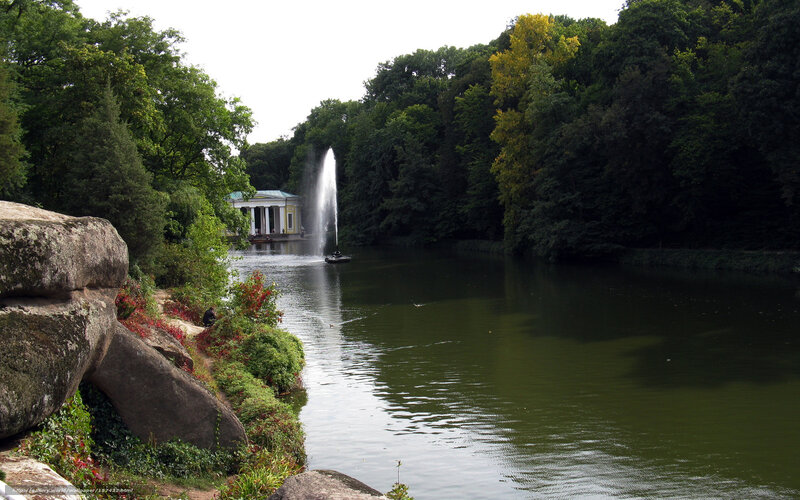 Park lake with fountain and pavilion