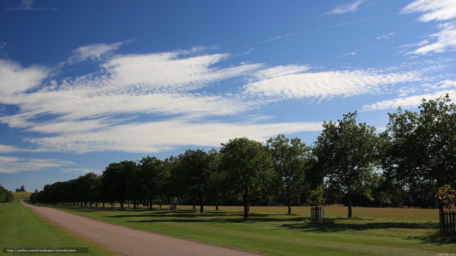 Park path under blue sky