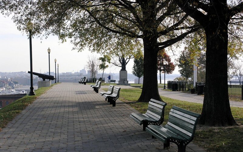 Park path with cannons and statue