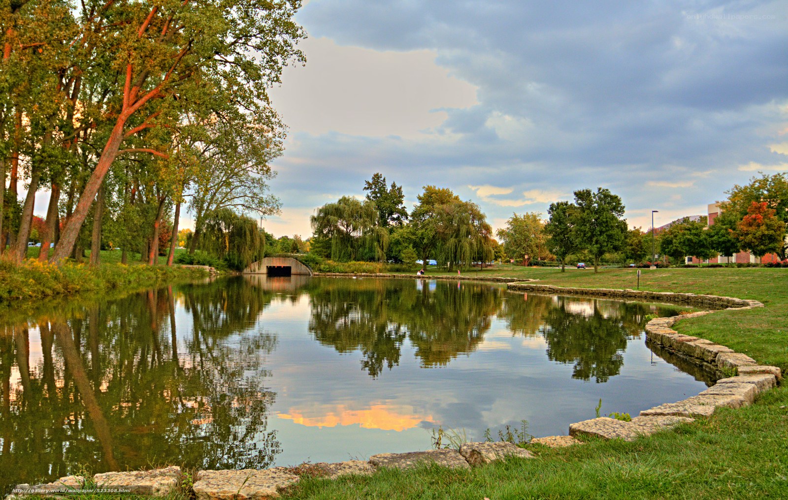 Park pond with stone bridge
