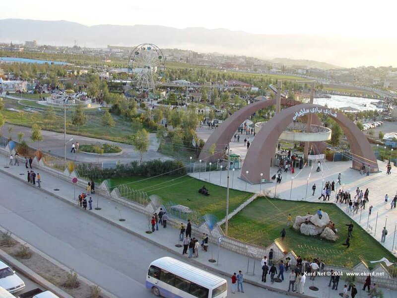 Park with Ferris wheel and arch