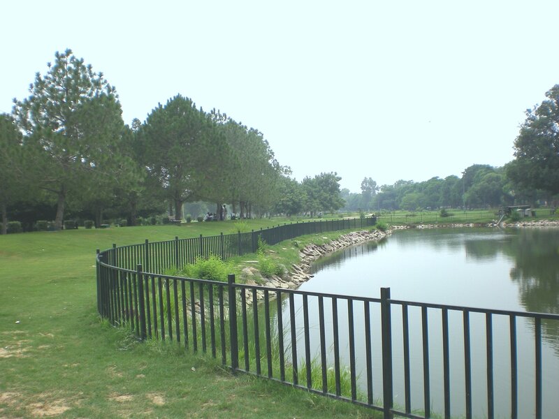 Park with lake and fence