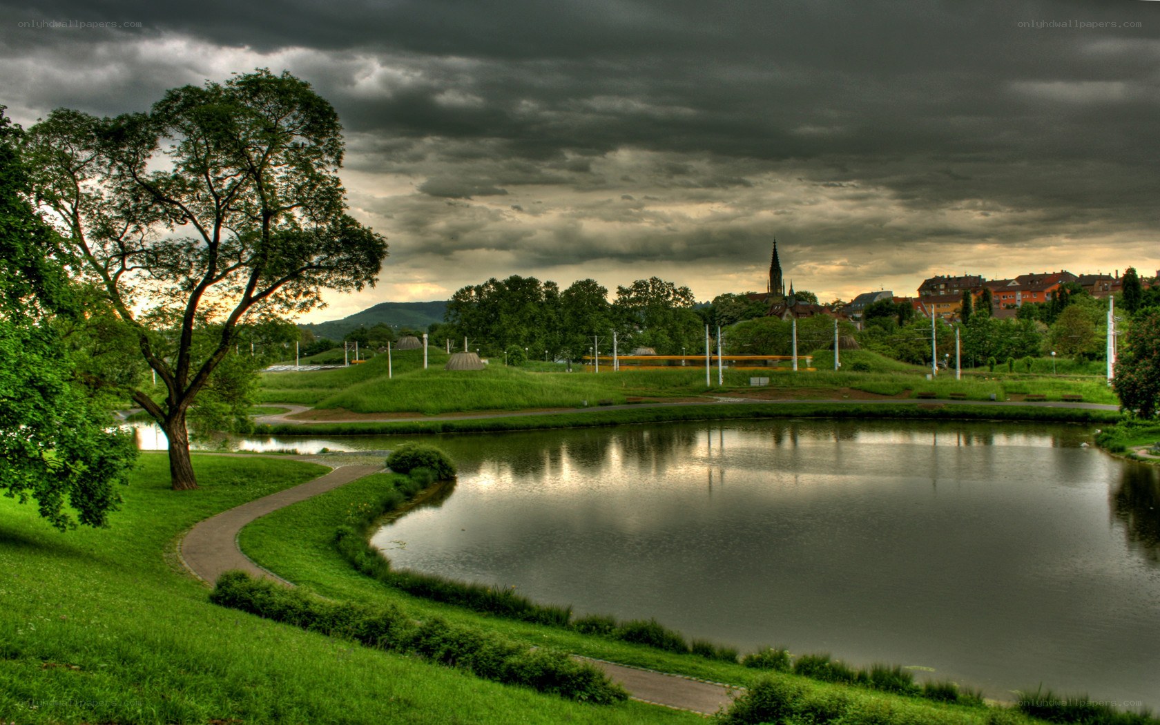 Park with pond and city view