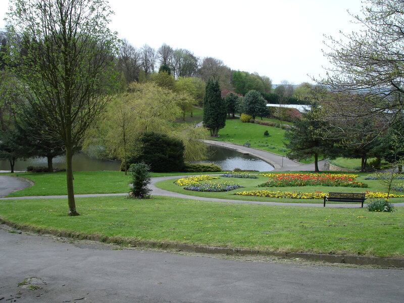 Park with pond and flower beds