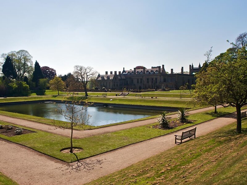 Park with pond and historic building
