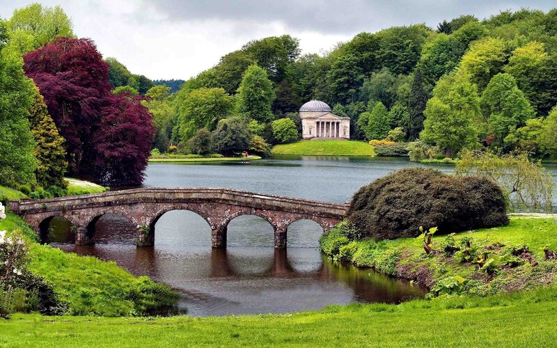 Park with stone bridge and temple
