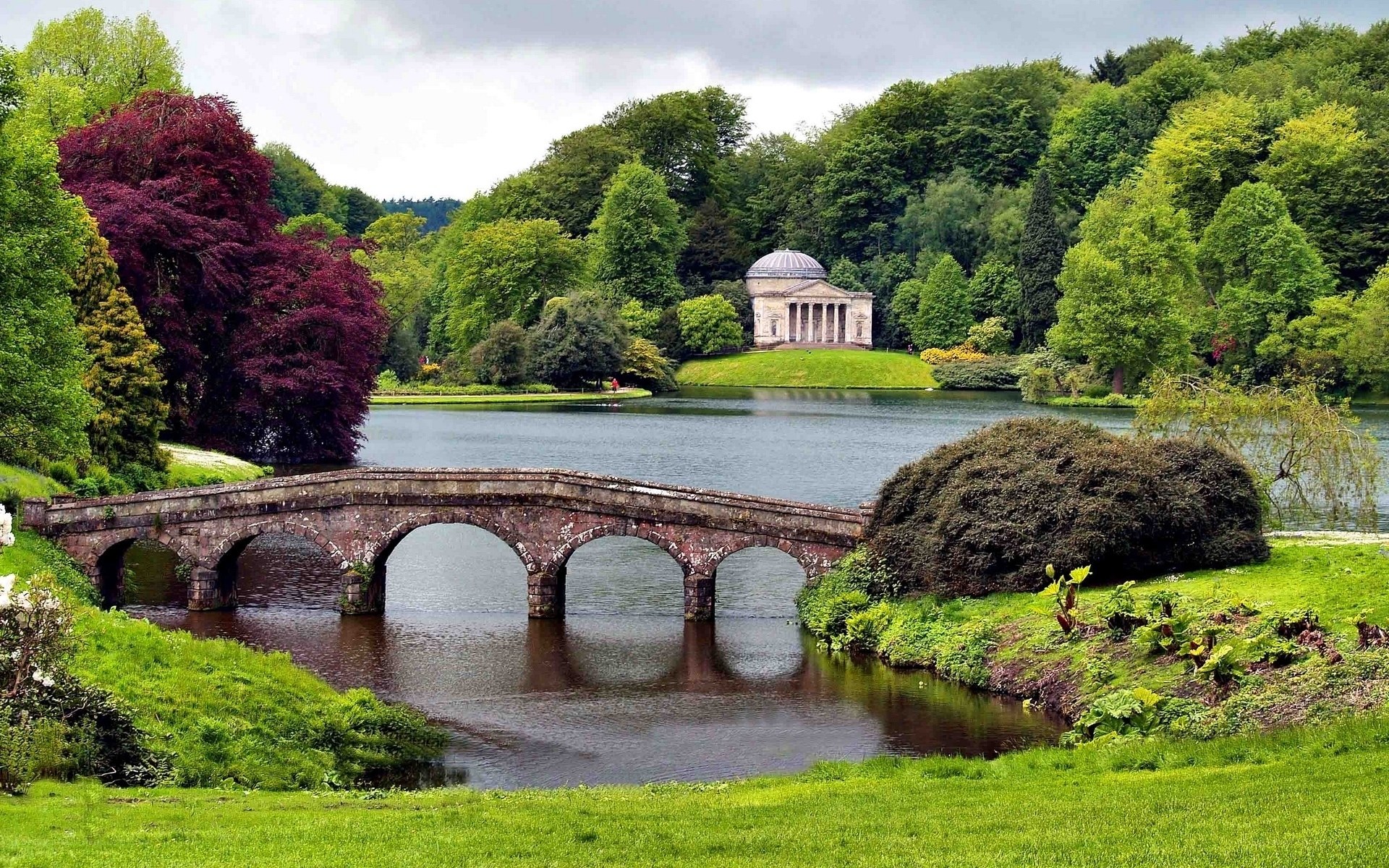 Park with stone bridge and temple