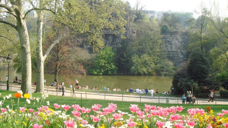 Park with tulips and lake