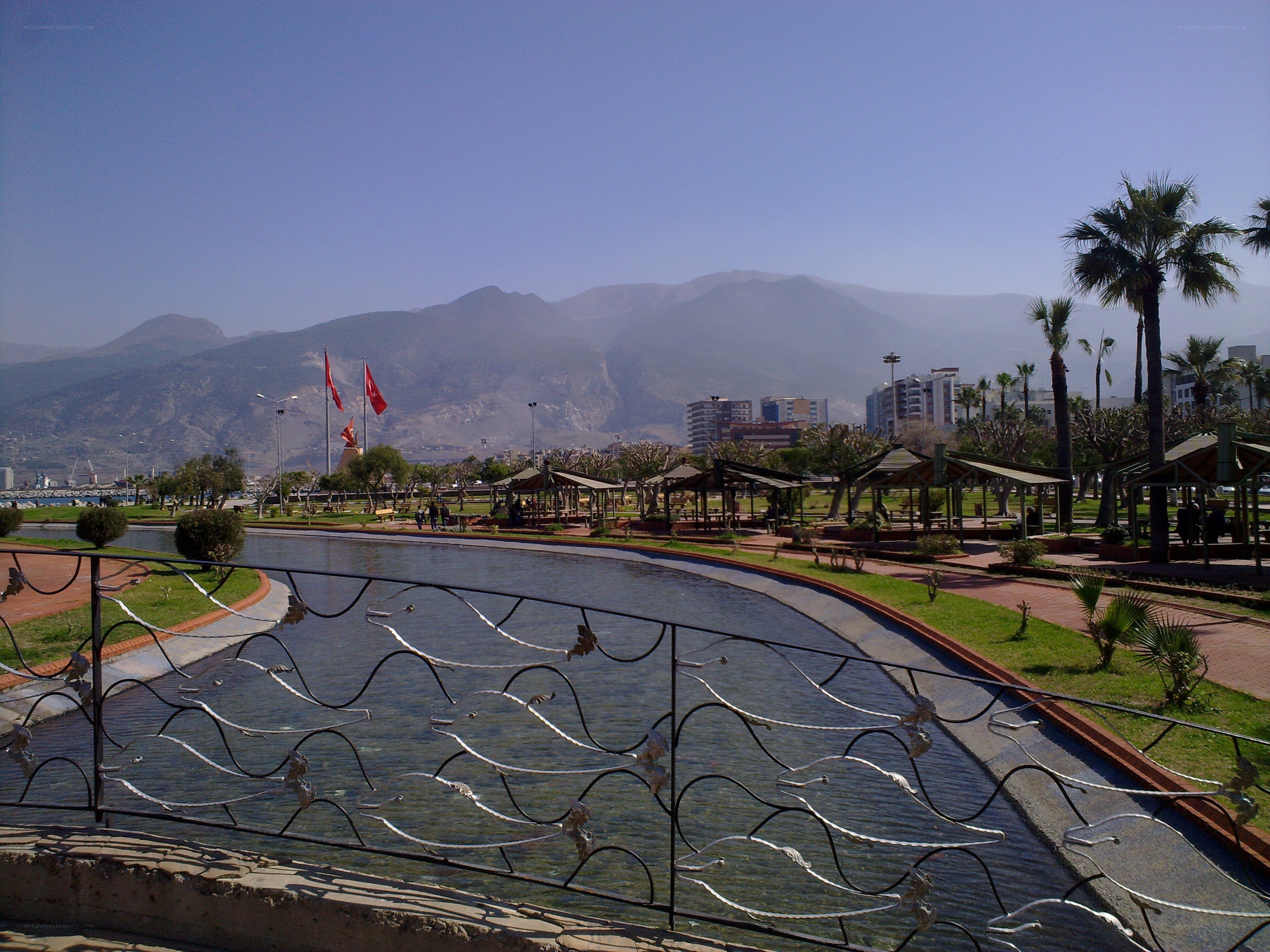 Park with water feature and mountains
