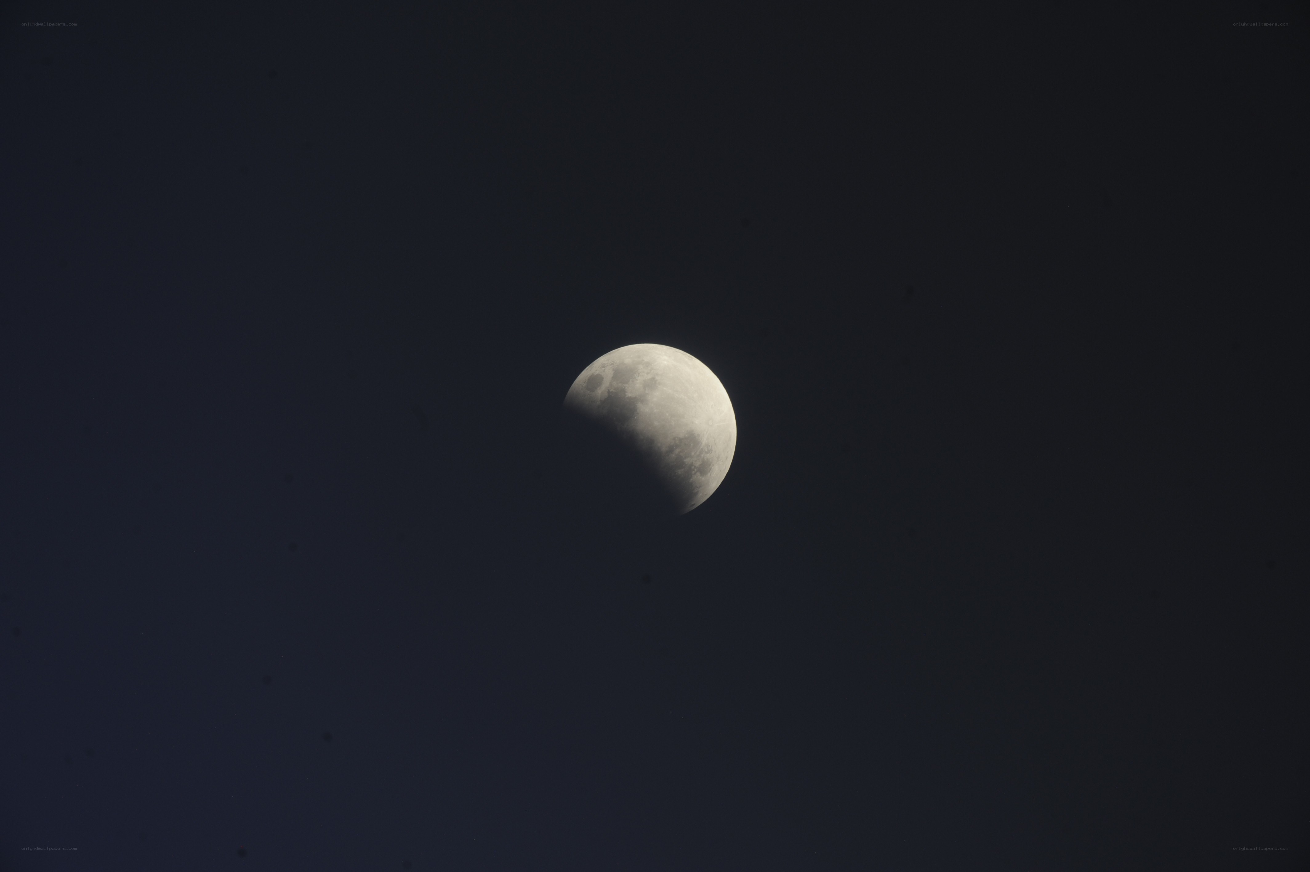 Partial lunar eclipse in night sky
