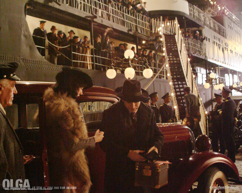 Passengers boarding a ship at night