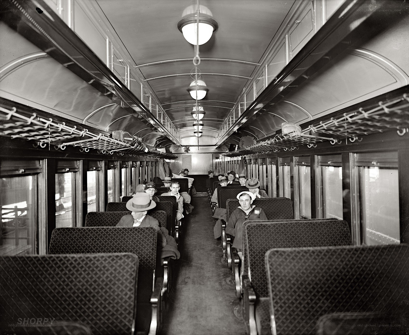 Passengers inside a vintage train car