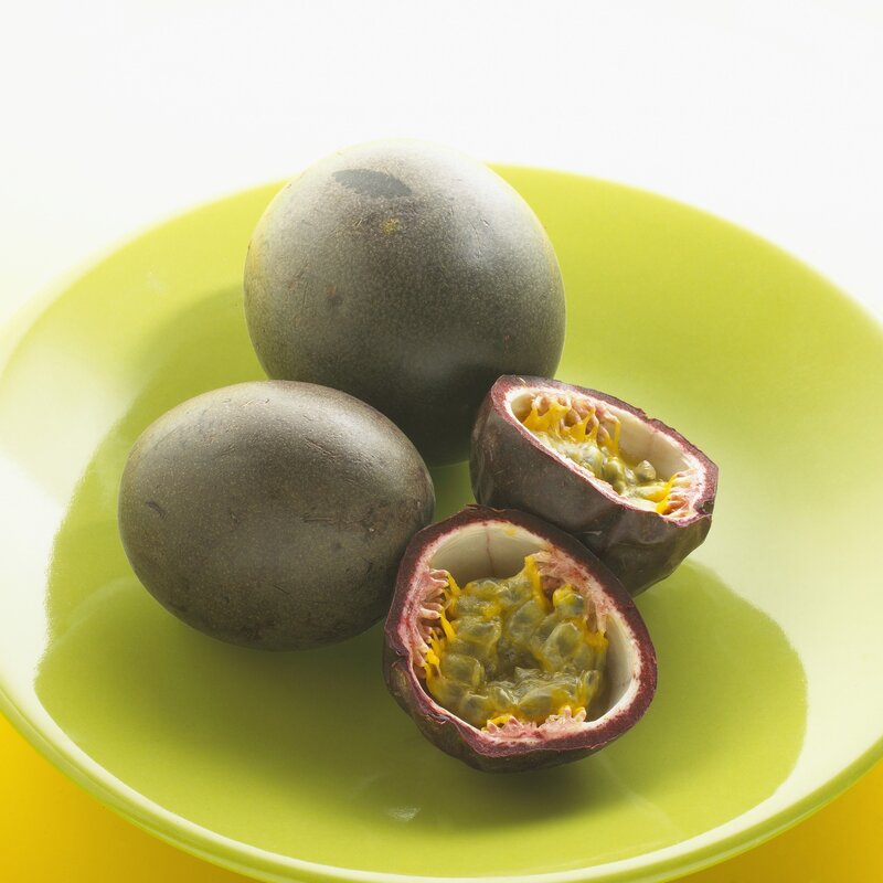 Passion fruits on a green plate