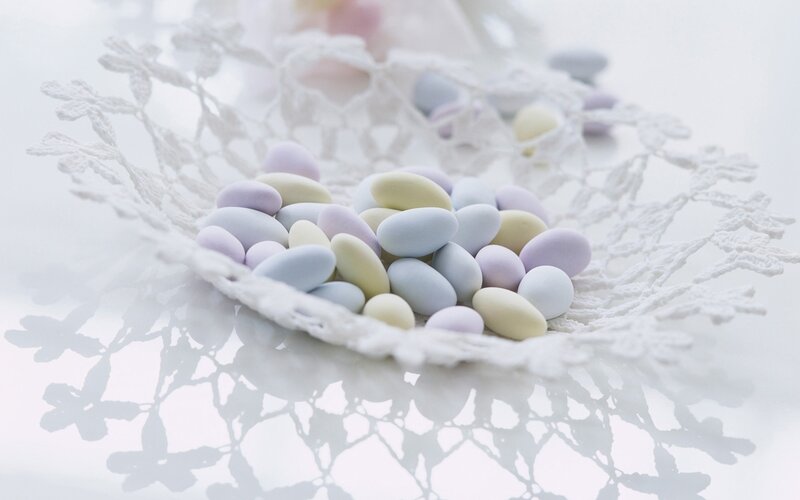 Pastel candies on lace
