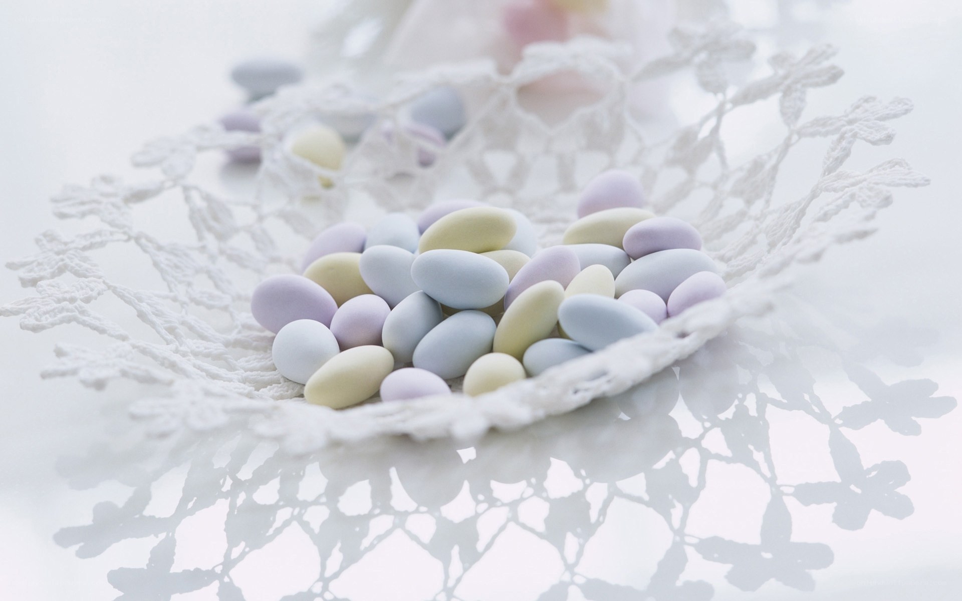 pastel candies on lace