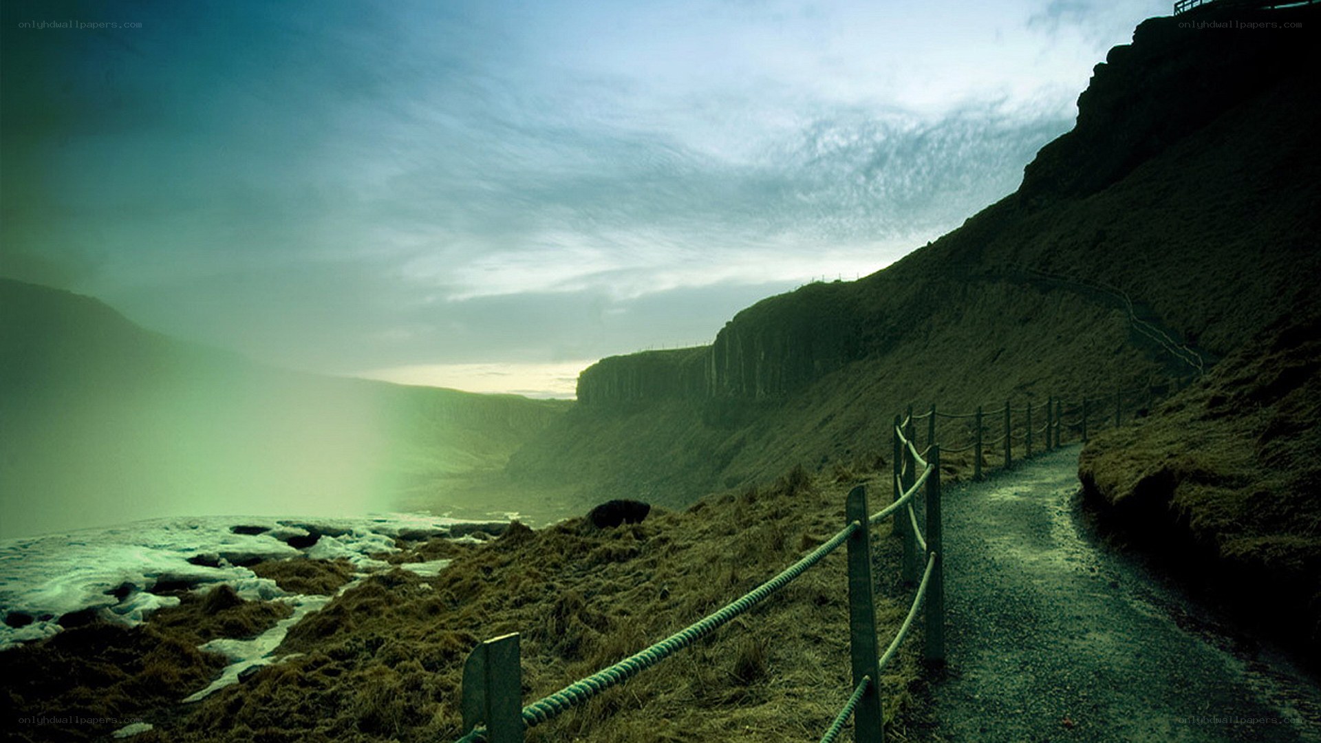 Path along a misty cliffside