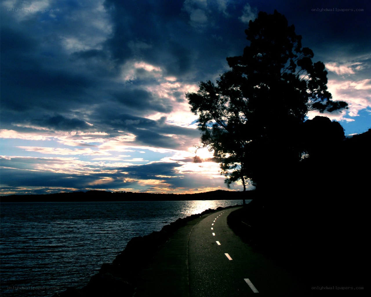 Path by the water at sunset