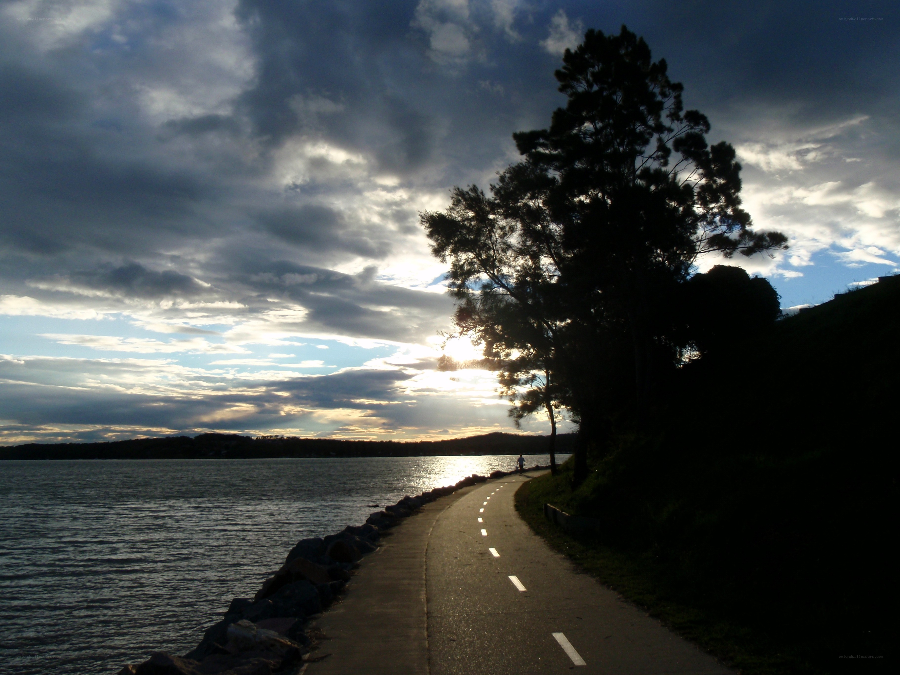 Path by the water at sunset