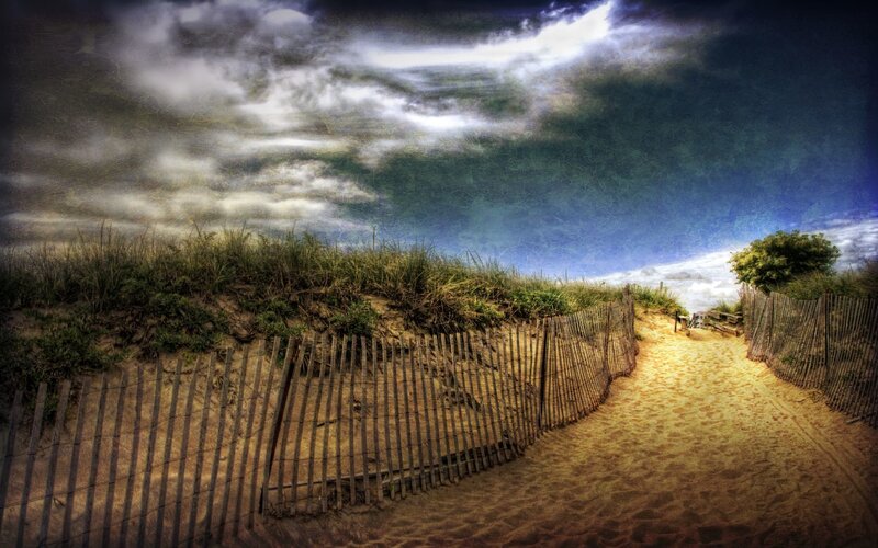 Path to the beach under dramatic sky