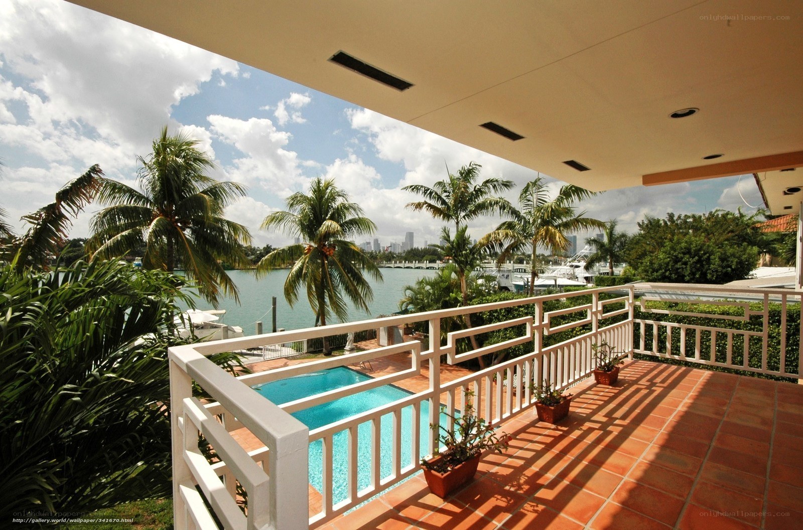 Patio with pool and city view