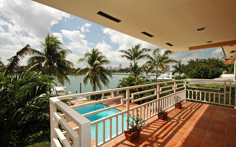 Patio with pool and water view