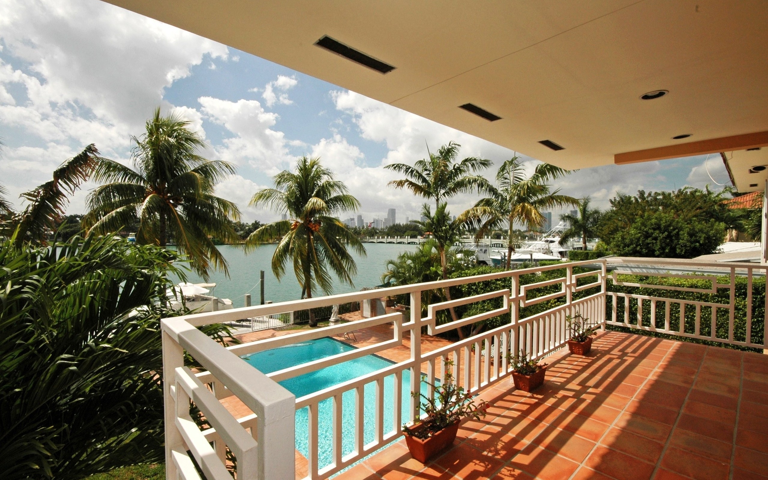 Patio with pool and water view
