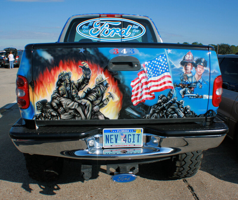 patriotic truck with firefighter art