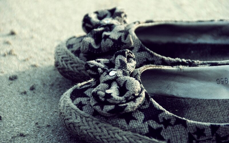 Patterned shoes on sand