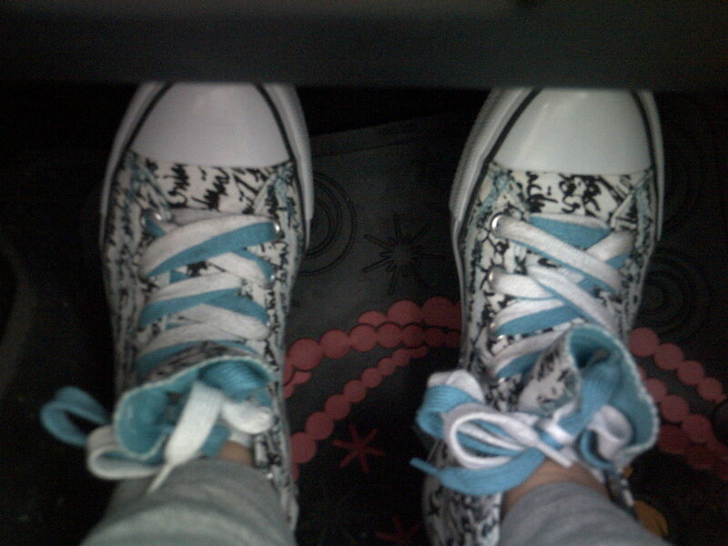 patterned sneakers with blue laces