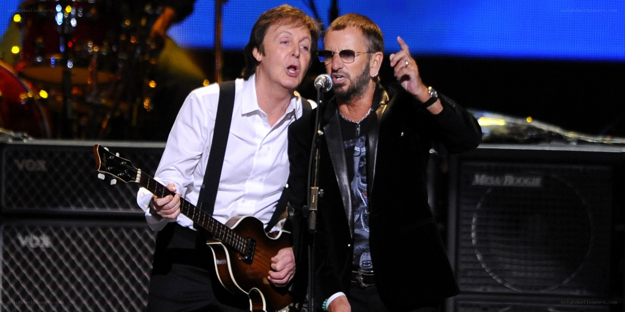 Paul McCartney and Ringo Starr performing