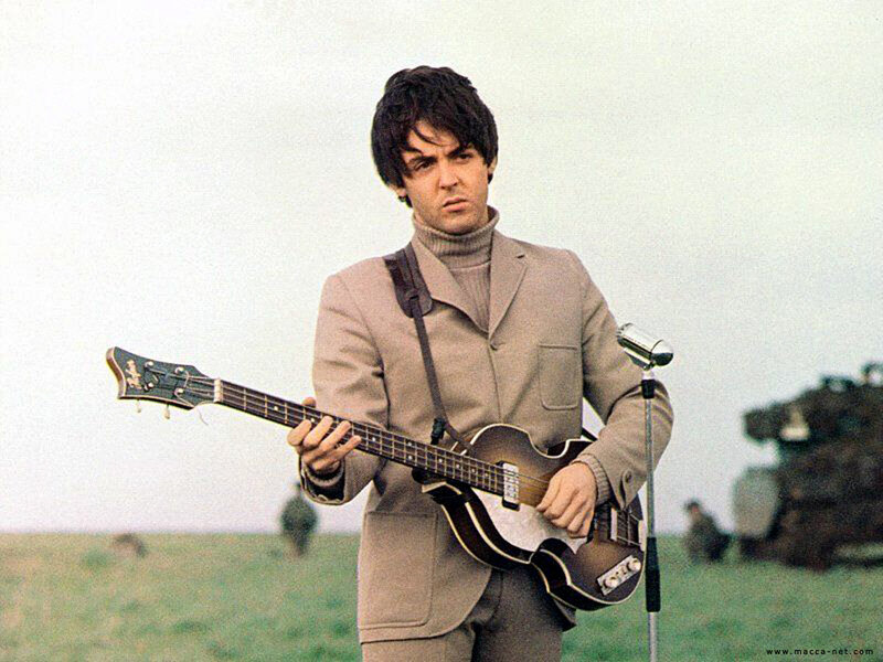 Paul McCartney playing bass guitar