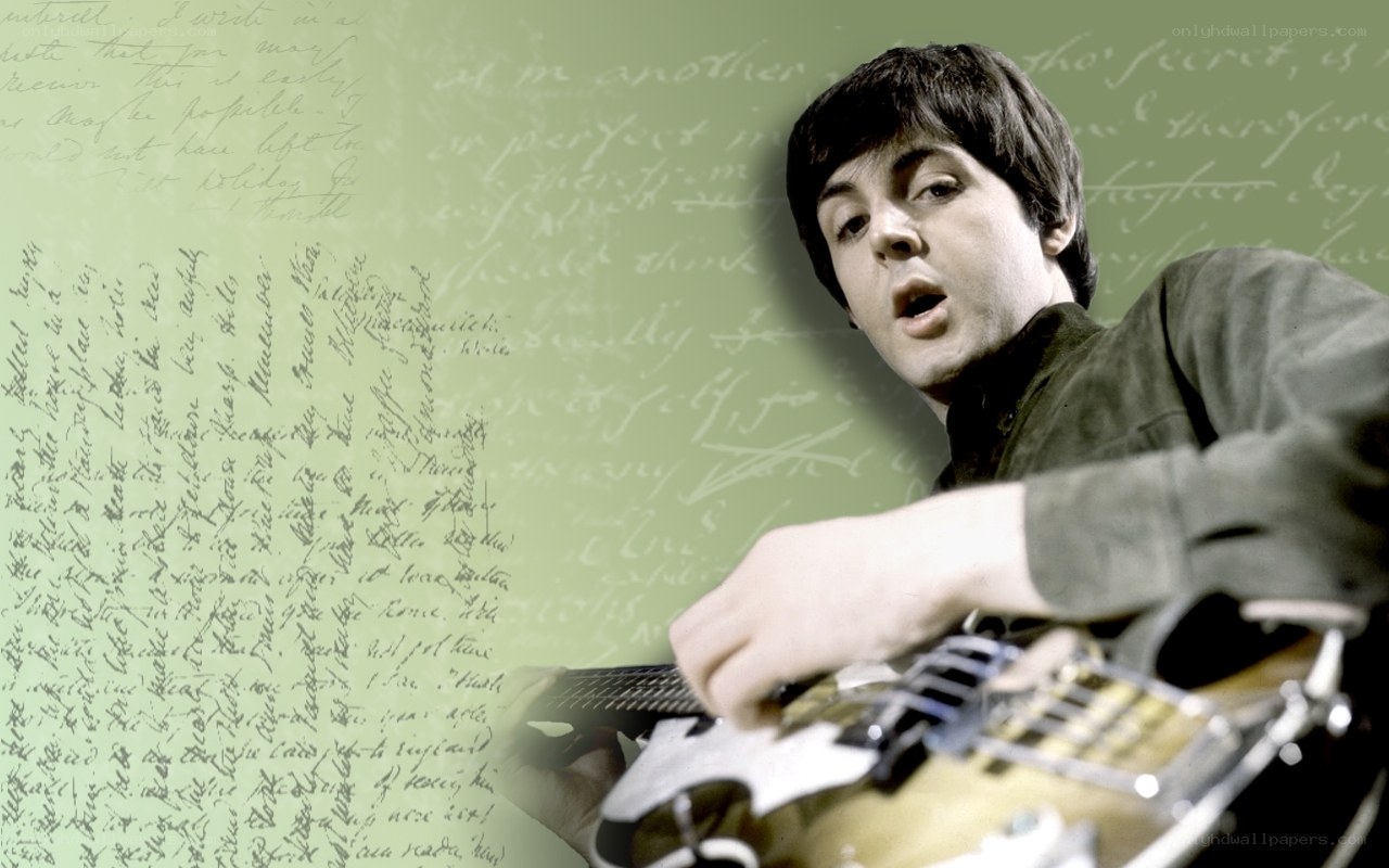 Paul McCartney playing guitar