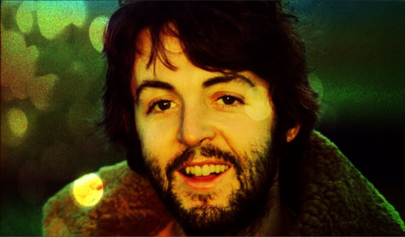 Paul McCartney smiling in green light