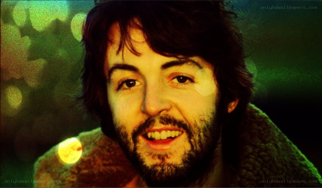 Paul McCartney smiling in green light