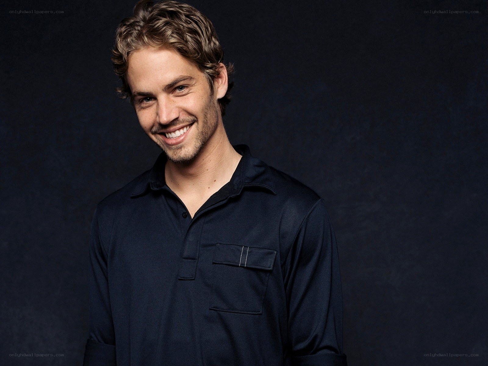 Paul Walker smiling in dark shirt