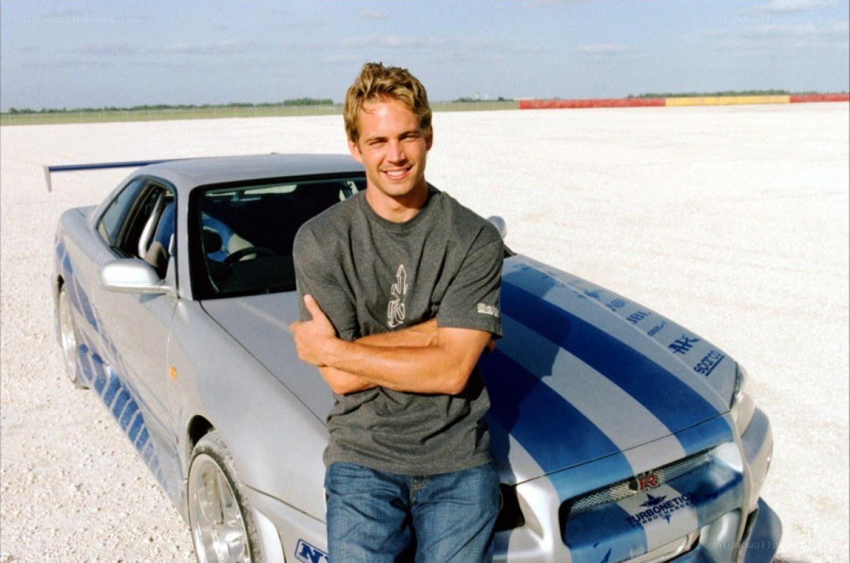 Paul Walker with a race car